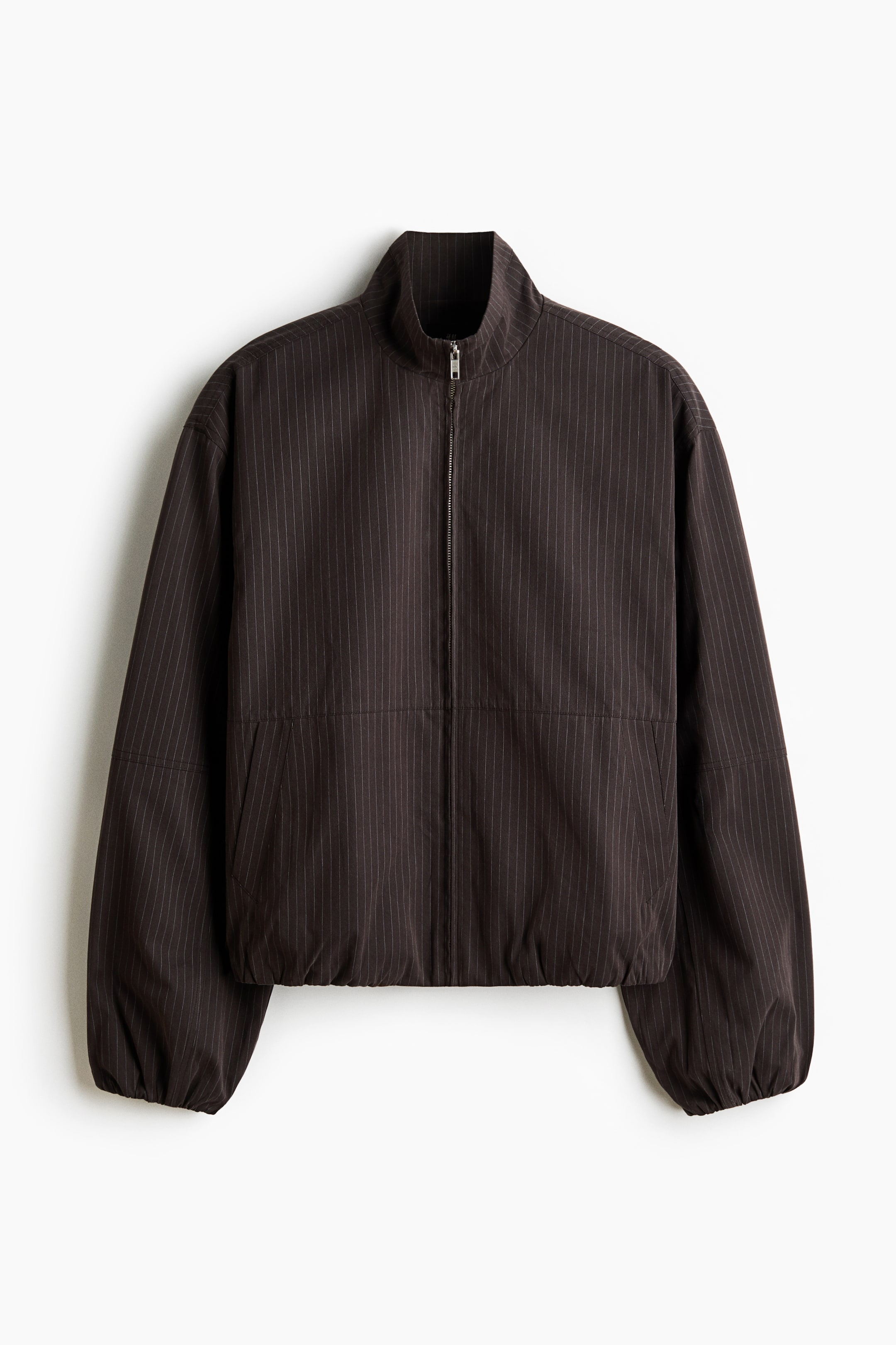 View larger image: A dark brown jacket with thin vertical pinstripes showcases its front, featuring a stand-up collar, a full-length silver front zipper, and elasticized cuffs and hem, with two discreet side pockets.