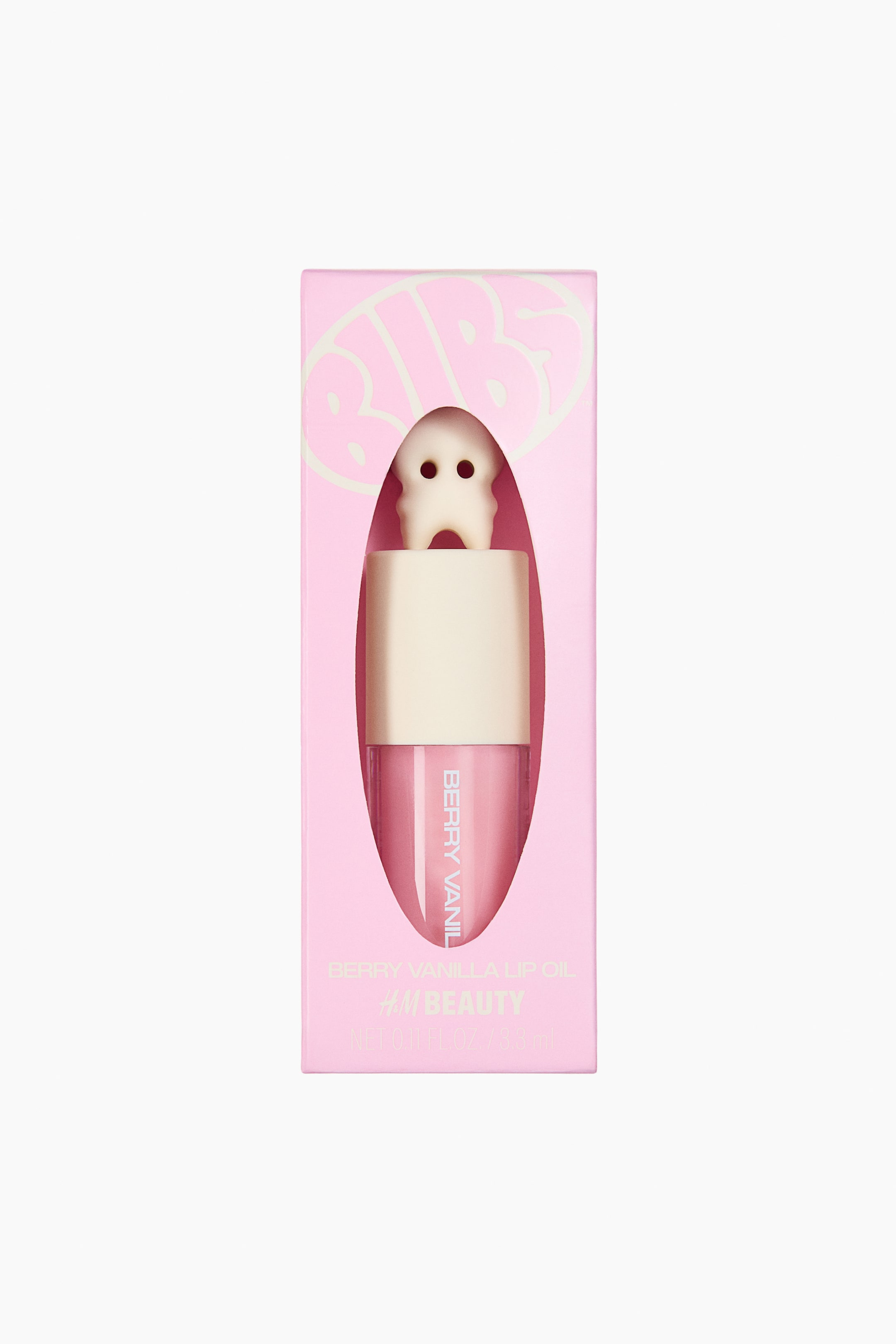 View larger image: The Berry Vanilla lip oil is showcased in a light pink rectangular box, facing forward. The box features an oval cut-out that reveals the clear bottle containing the pink lip oil, with "BERRY VANILLA" printed vertically. A cream-colored cap tops the bottle, from which a white ghost-shaped applicator with two black eyes emerges. "BIBS" is also visible in light pink lettering on the top of the box.