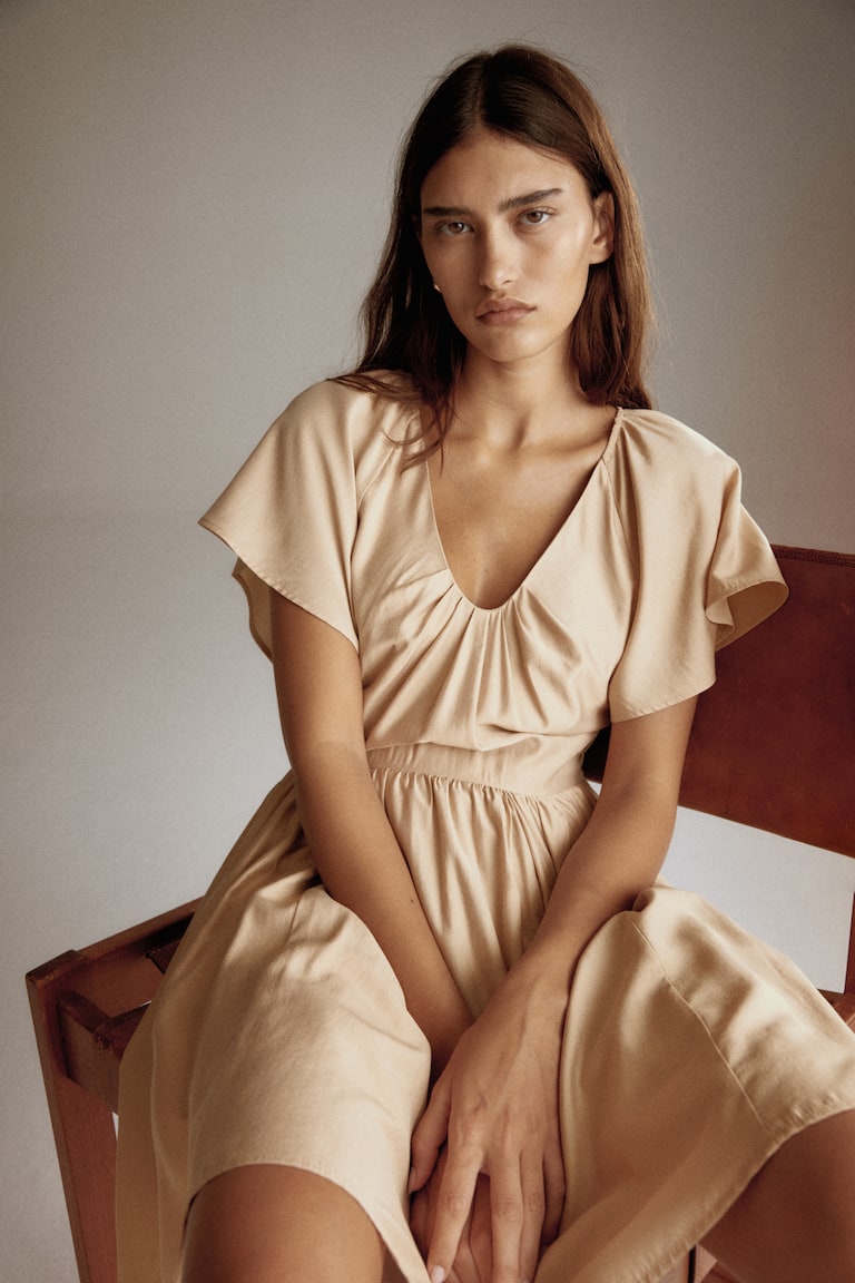 beige flared dress Women's Beige Dress with Flared Skirt