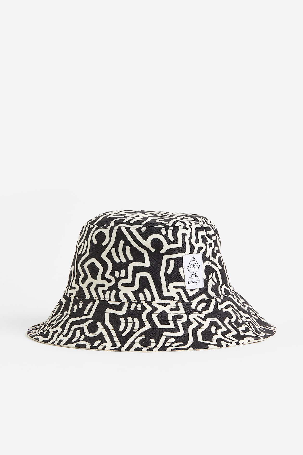 Reversible Bucket Hat Light beige/Keith Haring Men H&M AU