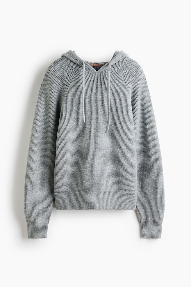 A grey ribbed knit hoodie is showcasing its front, featuring raglan sleeves, a drawstring hood with drawstrings, ribbed cuffs, and a ribbed hem. - 1