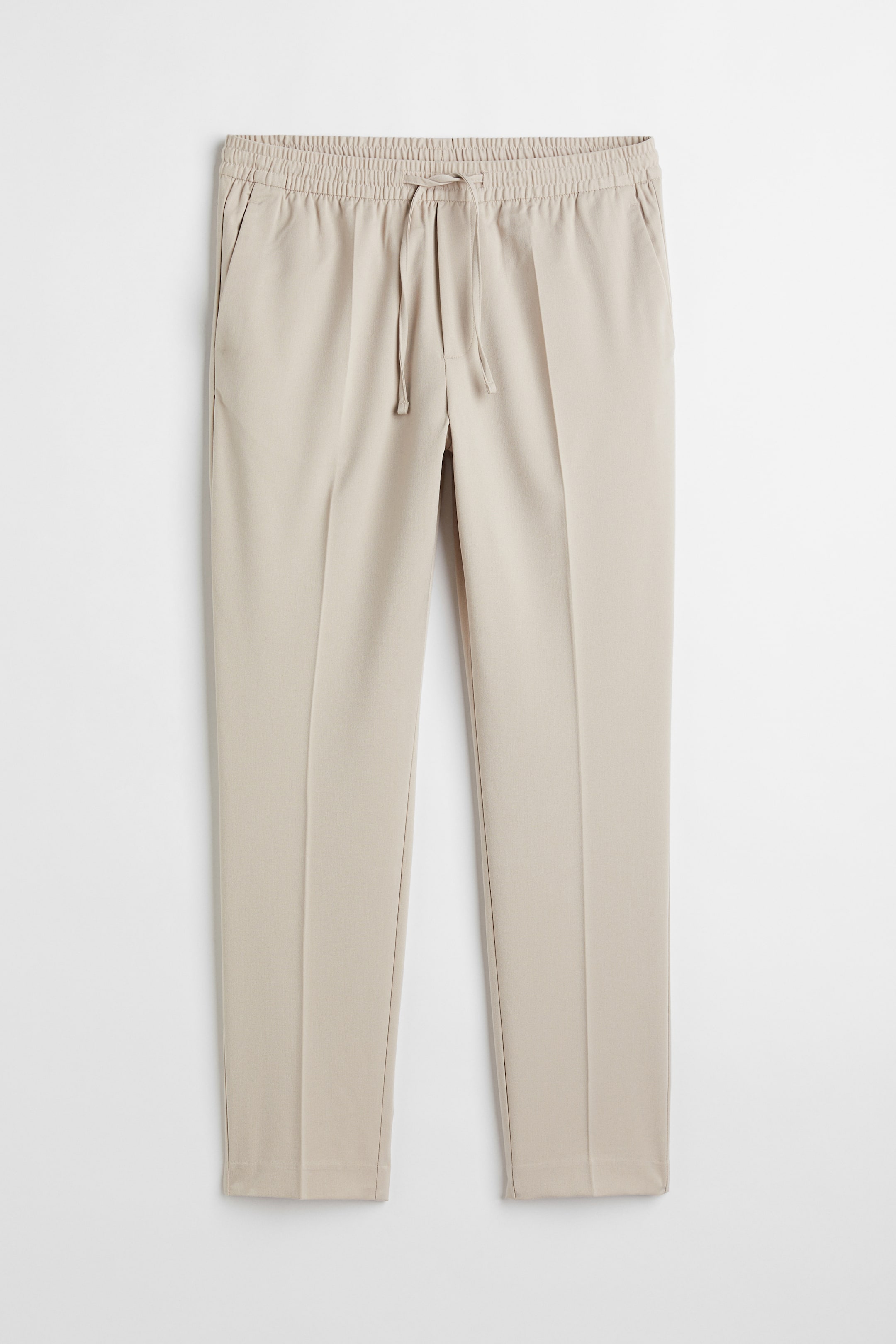 הצגת תמונה גדולה יותר: מכנסי טרנינג Slim Fit - Light beige - Men | H&M IL 1