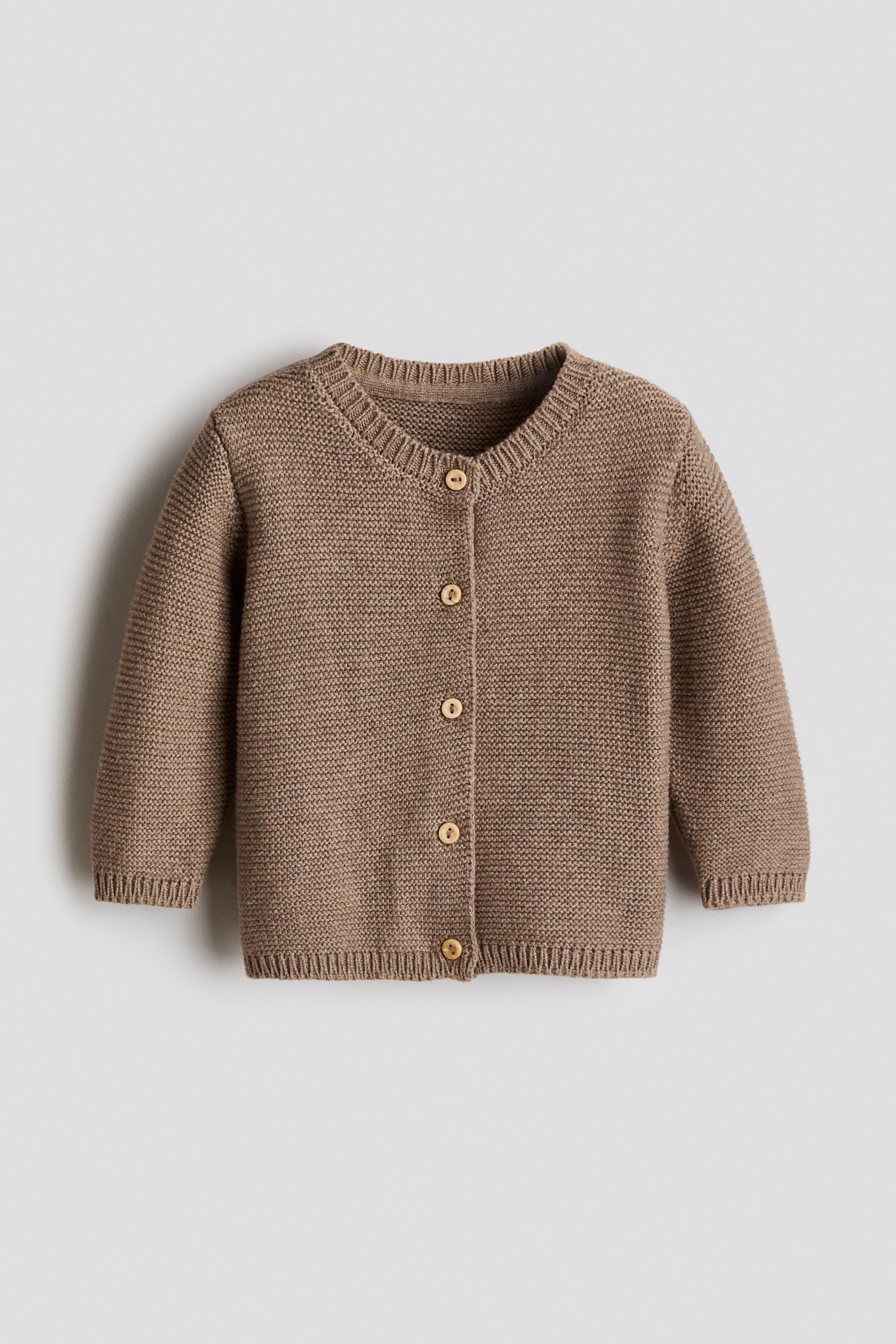 View larger image: A brown textured knit cardigan is shown from the front. It features a round neckline, a button-front closure with five wooden buttons, long sleeves, and ribbing around the neckline, cuffs, and hem.