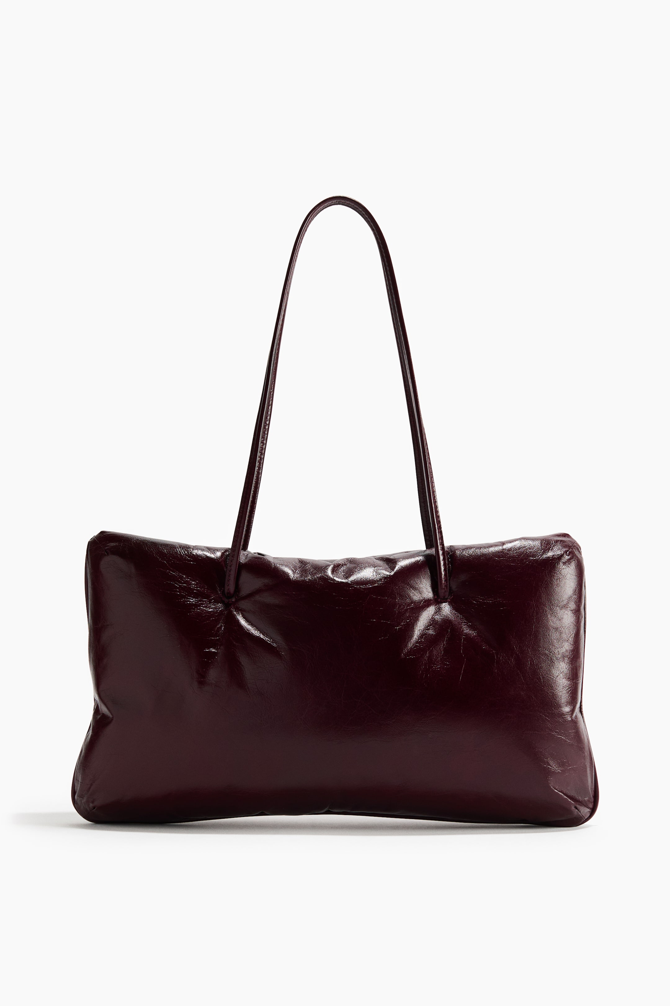 View larger image: A dark red rectangular shoulder bag is shown from the front, featuring a shiny, crinkled texture and two slim shoulder straps.