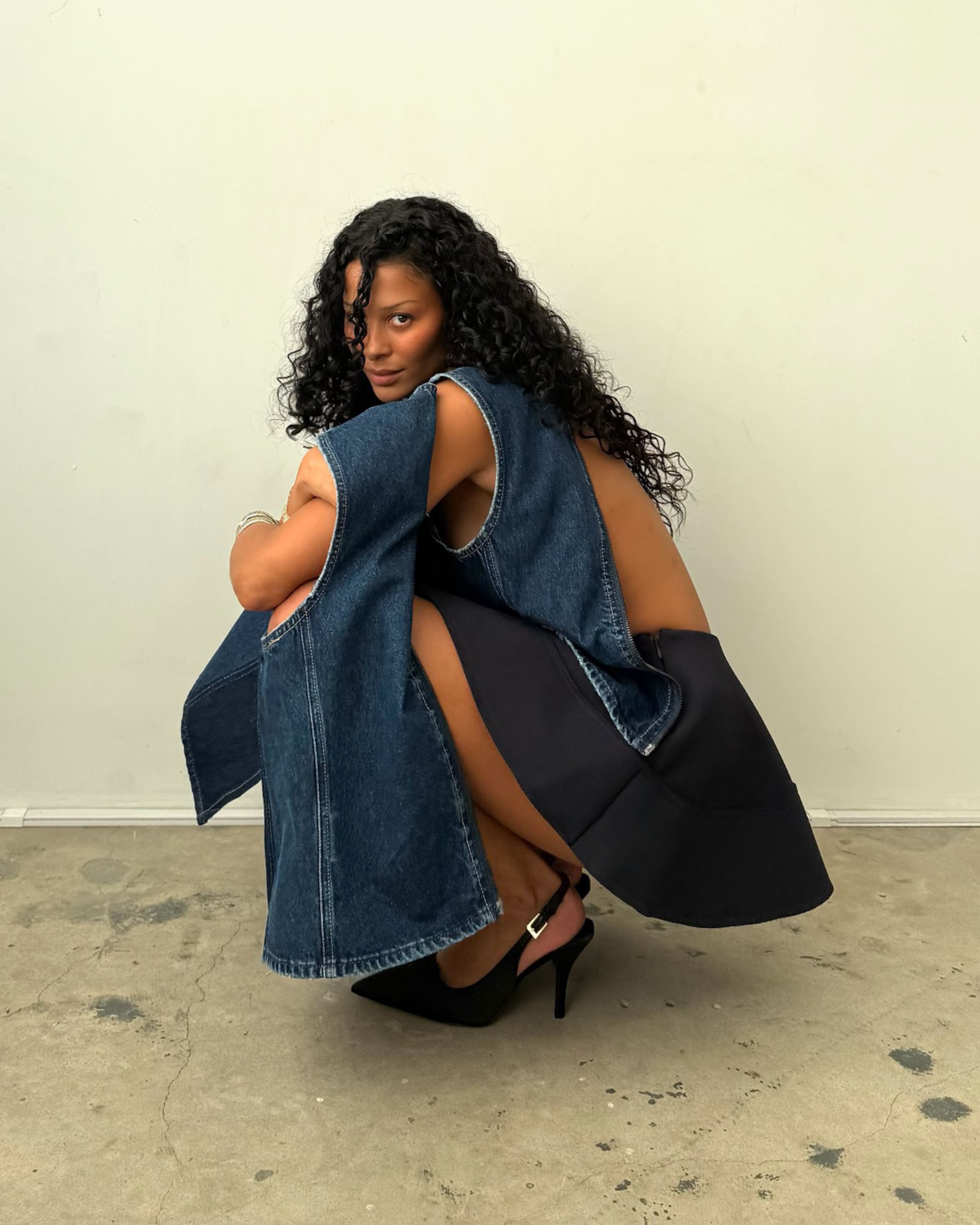 Model wearing a leather jacket and denim